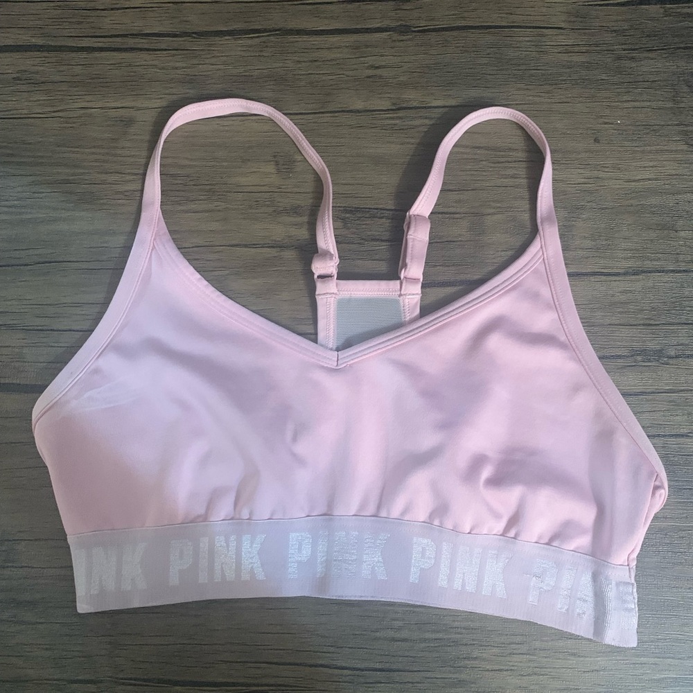Pink and orange Victoria secrete (pink) sports bras ,sold together